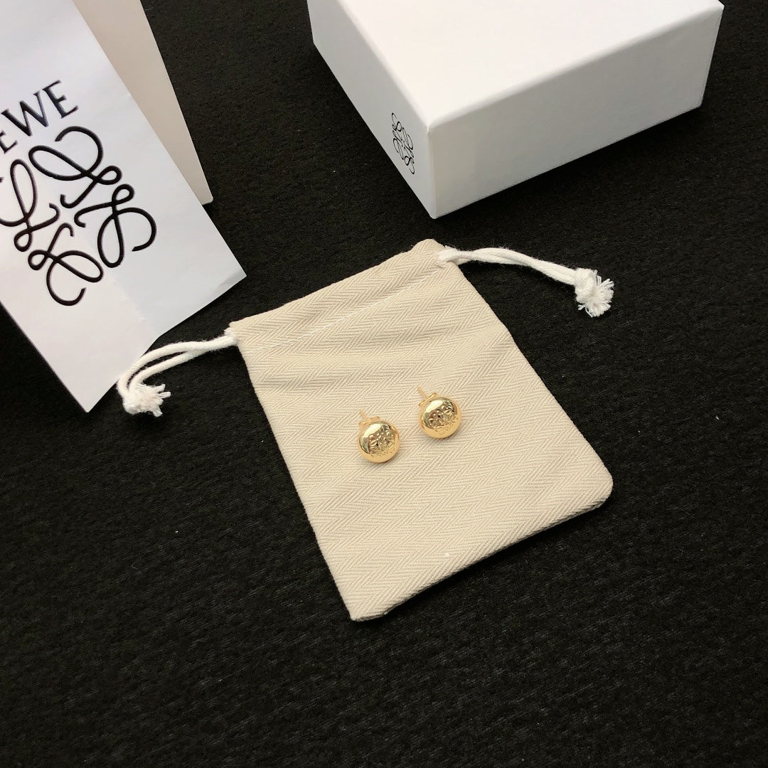 Martin Graham stud earrings in polished metal-tone – main product view