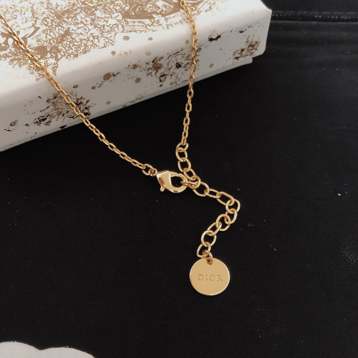 Martin Graham pendant necklace in polished metal-tone – front view