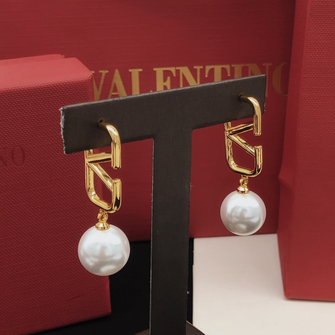 Martin Graham stud earrings in polished metal-tone – front view
