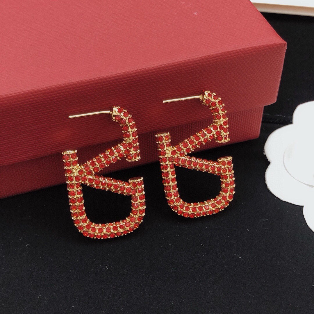 Martin Graham stud earrings in polished metal-tone – front view