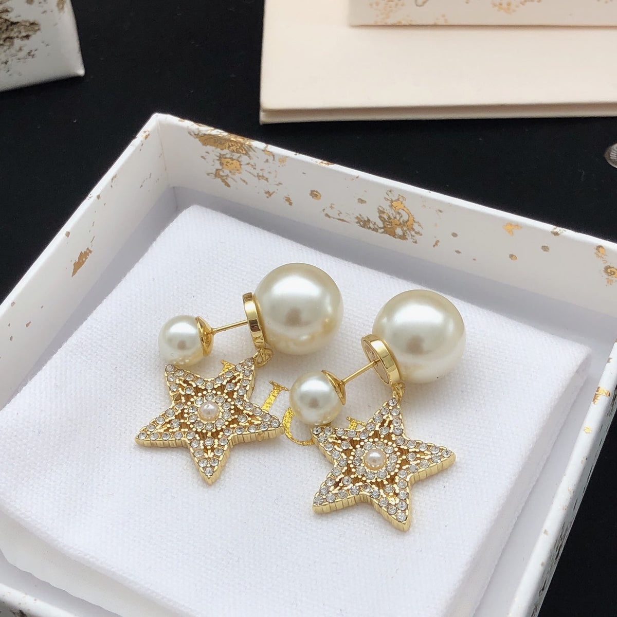 Martin Graham stud earrings in polished metal-tone – front view