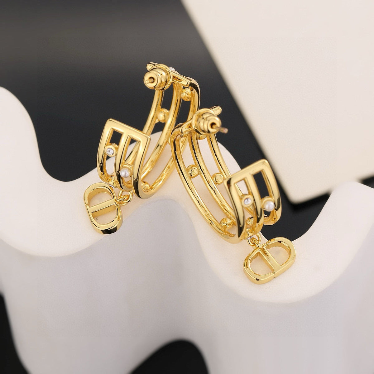 Martin Graham stud earrings in polished metal-tone – front view
