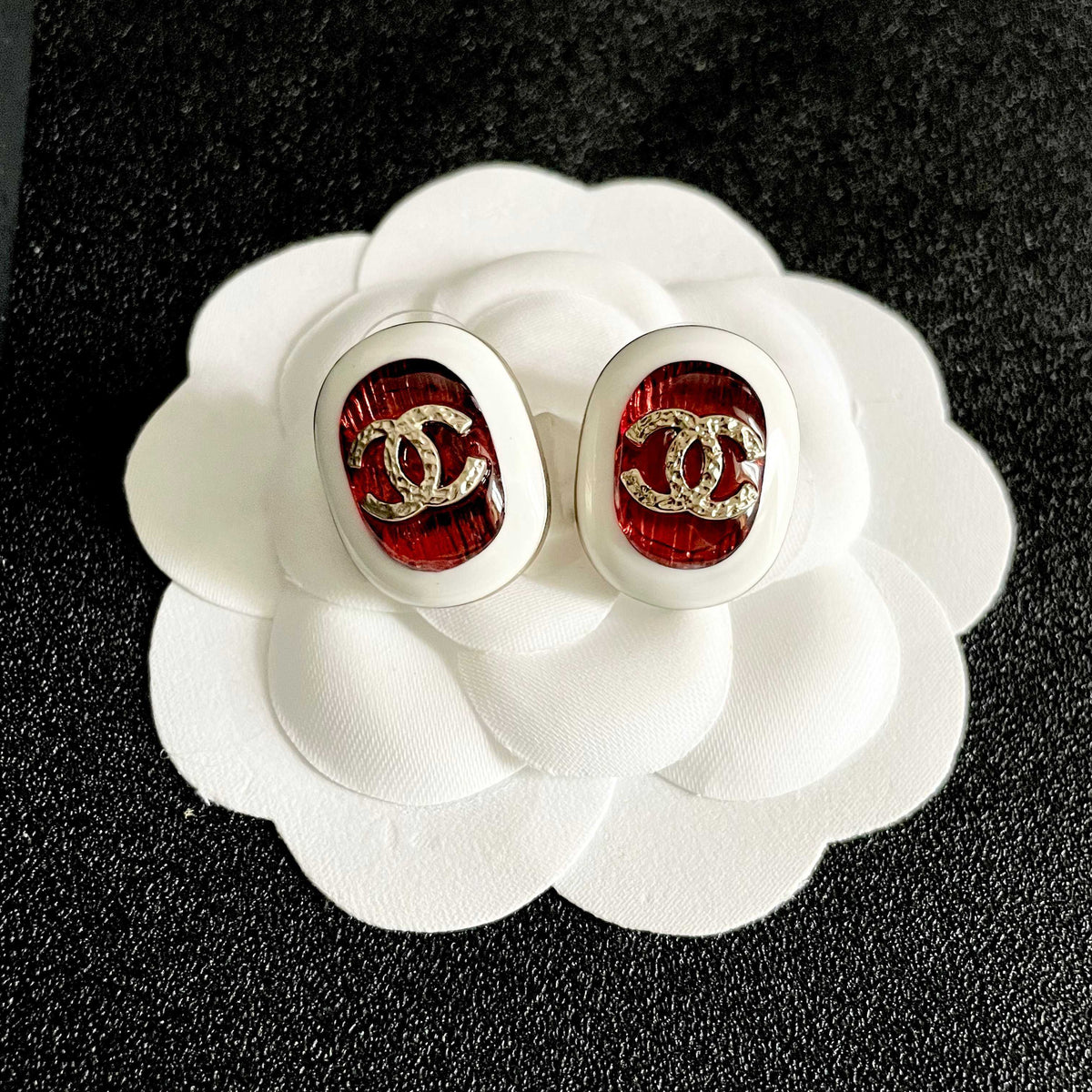 Martin Graham stud earrings in polished metal-tone – front product view