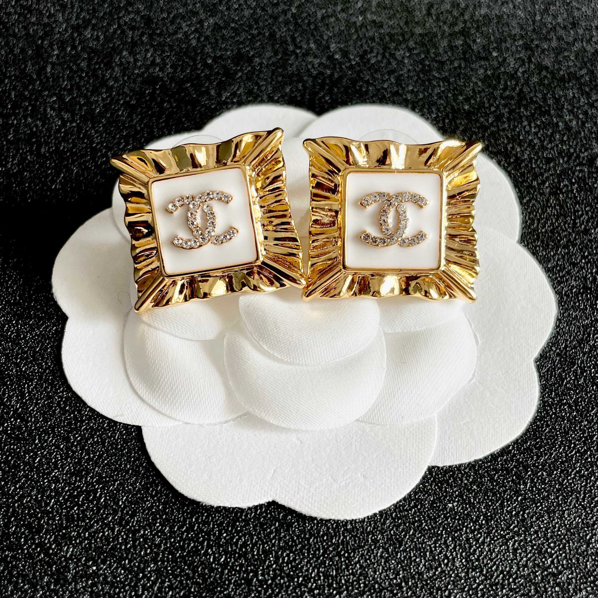 Martin Graham stud earrings in polished metal-tone – front product view
