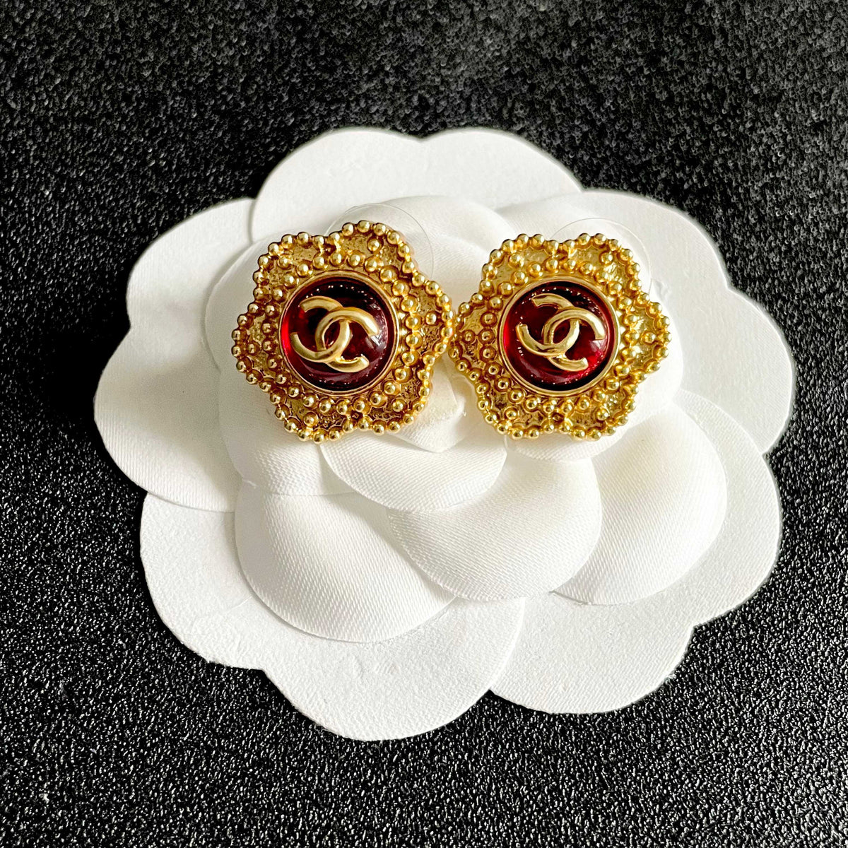 Martin Graham stud earrings in polished metal-tone – front product view