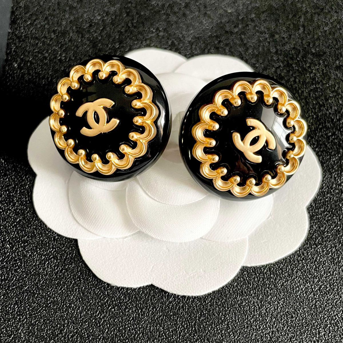 Martin Graham stud earrings in polished metal-tone – front product view