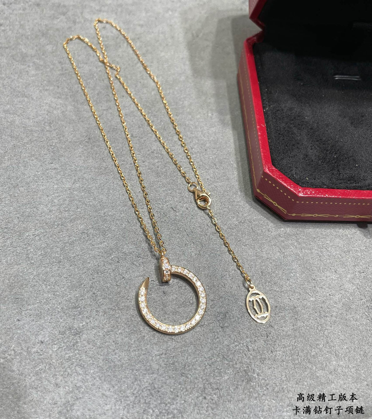Martin Graham pendant necklace in polished metal-tone – front view