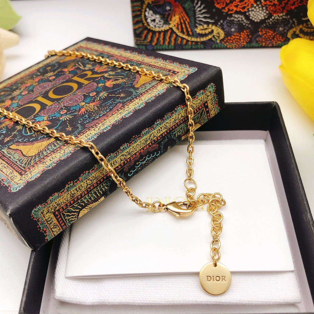 Martin Graham pendant necklace in polished metal-tone – front view