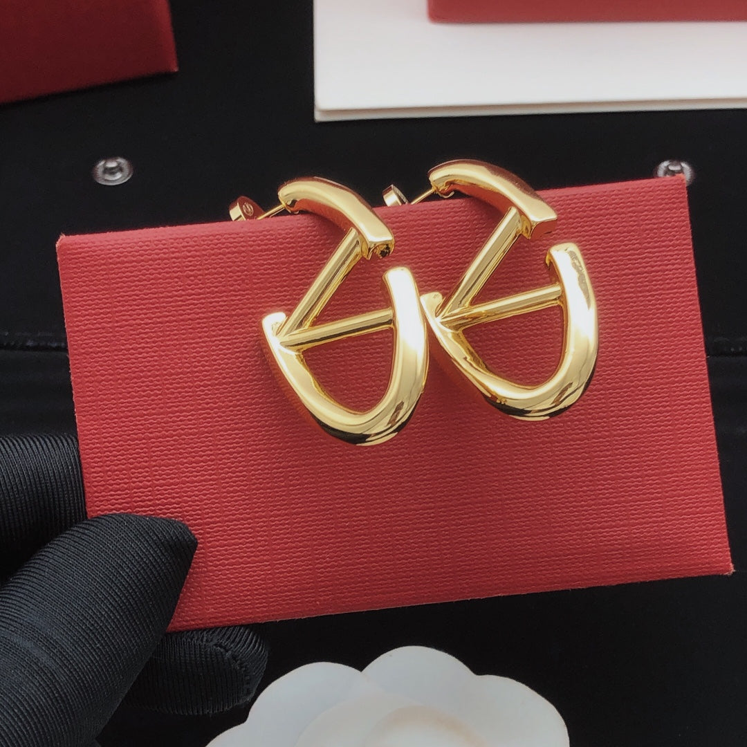Martin Graham drop earrings in polished metal-tone – front view