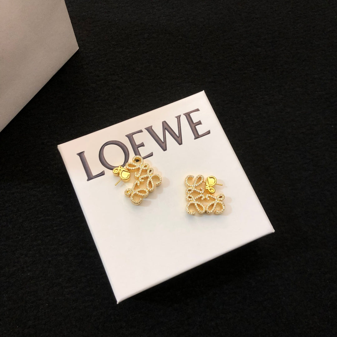Martin Graham stud earrings in polished metal-tone – front view