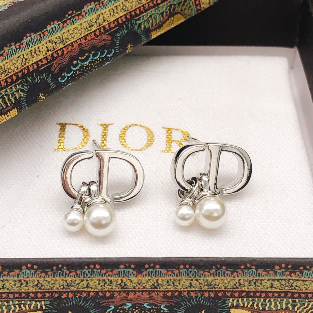 Martin Graham stud earrings in polished metal-tone – front view