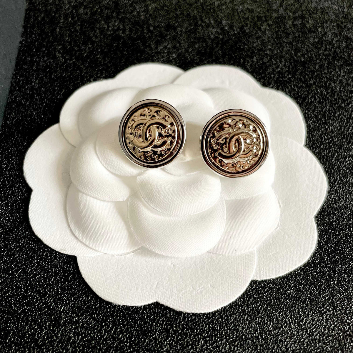Martin Graham stud earrings in polished metal-tone – front product view