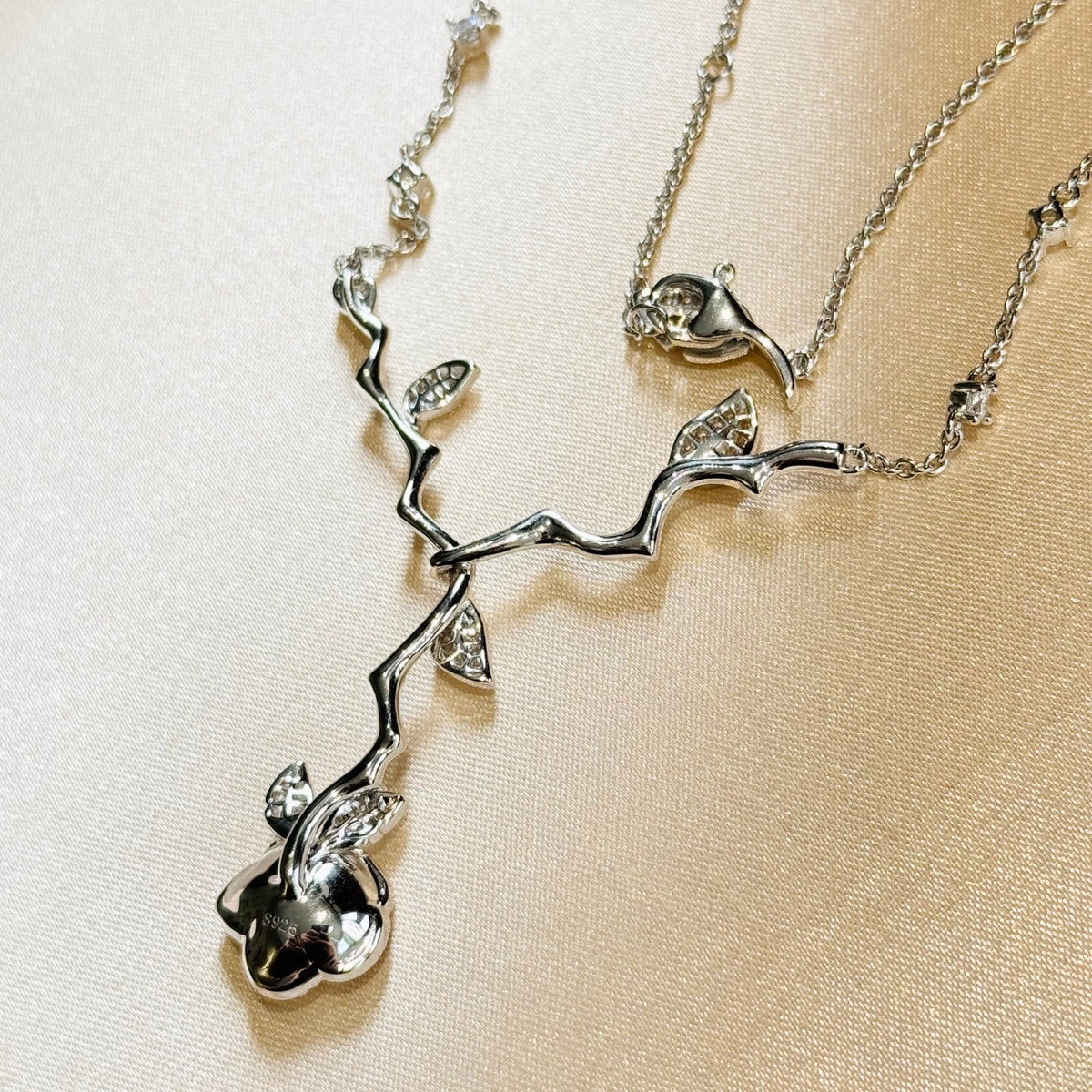 Martin Graham pendant necklace in polished metal-tone – front view