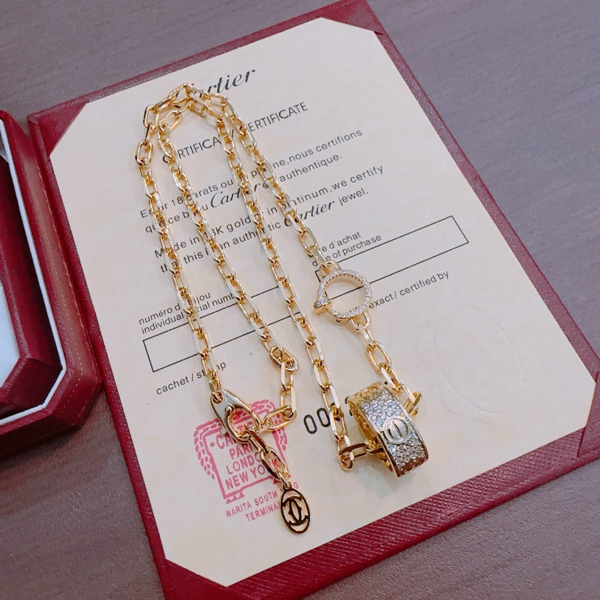 Martin Graham pendant necklace in polished metal-tone – front view