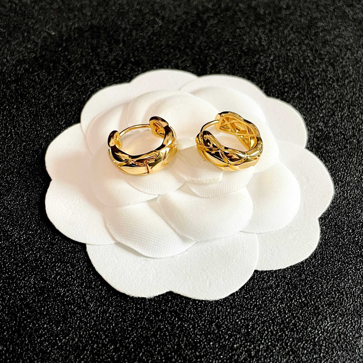 Martin Graham stud earrings in polished metal-tone – front product view