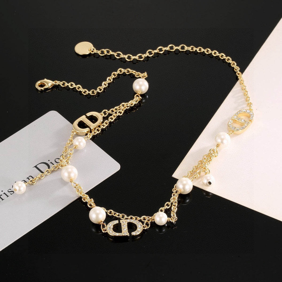 Martin Graham pendant necklace in polished metal-tone – front view