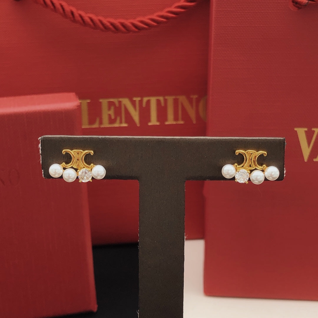 Martin Graham stud earrings in polished metal-tone – front view