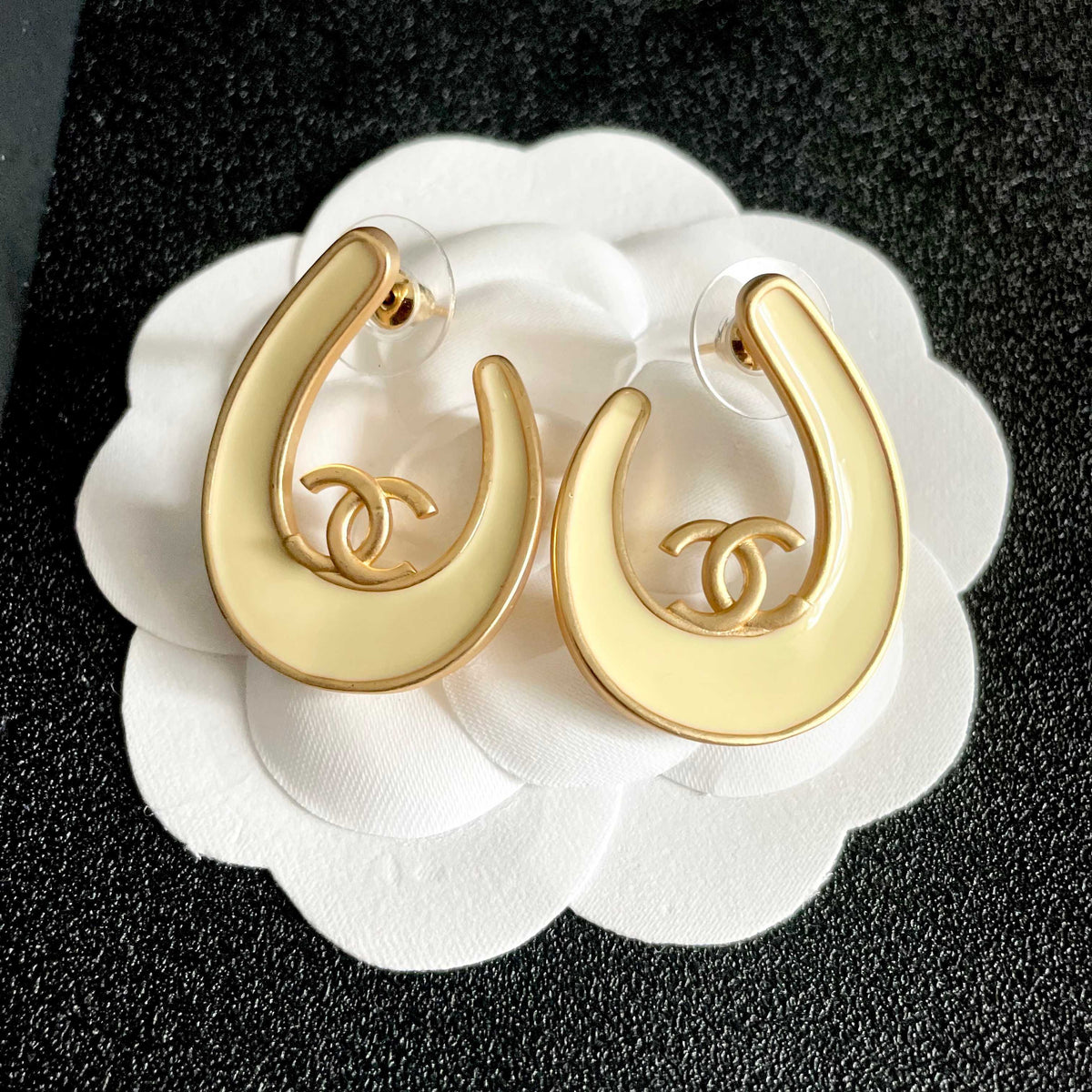Martin Graham stud earrings in polished metal-tone – front product view
