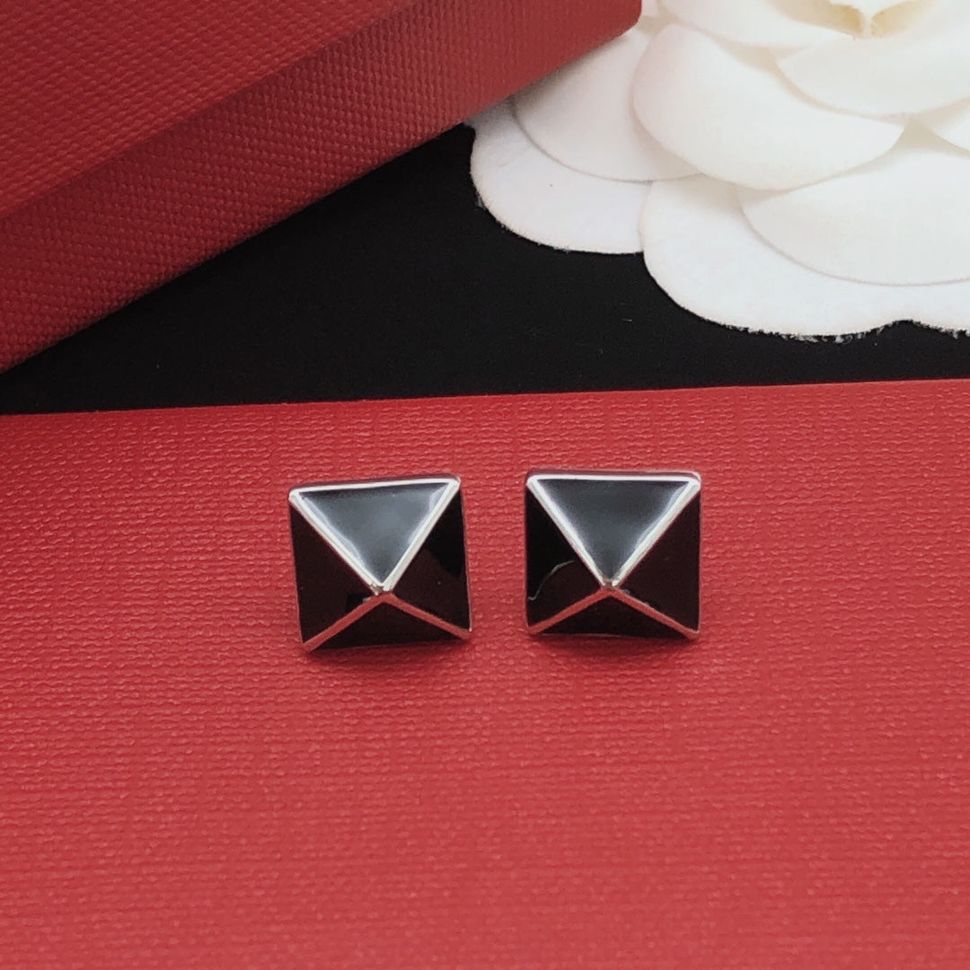 Martin Graham stud earrings in polished metal-tone – front view