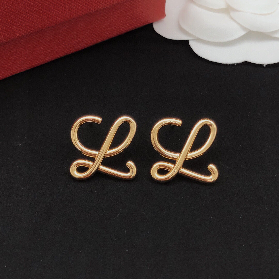 Martin Graham stud earrings in polished metal-tone – front view