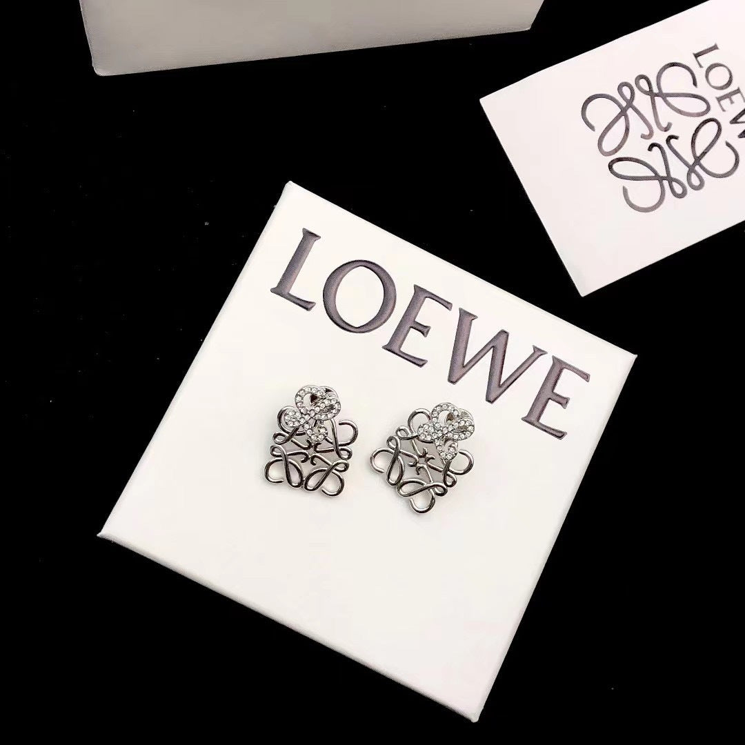 Martin Graham stud earrings in polished metal-tone – detail view