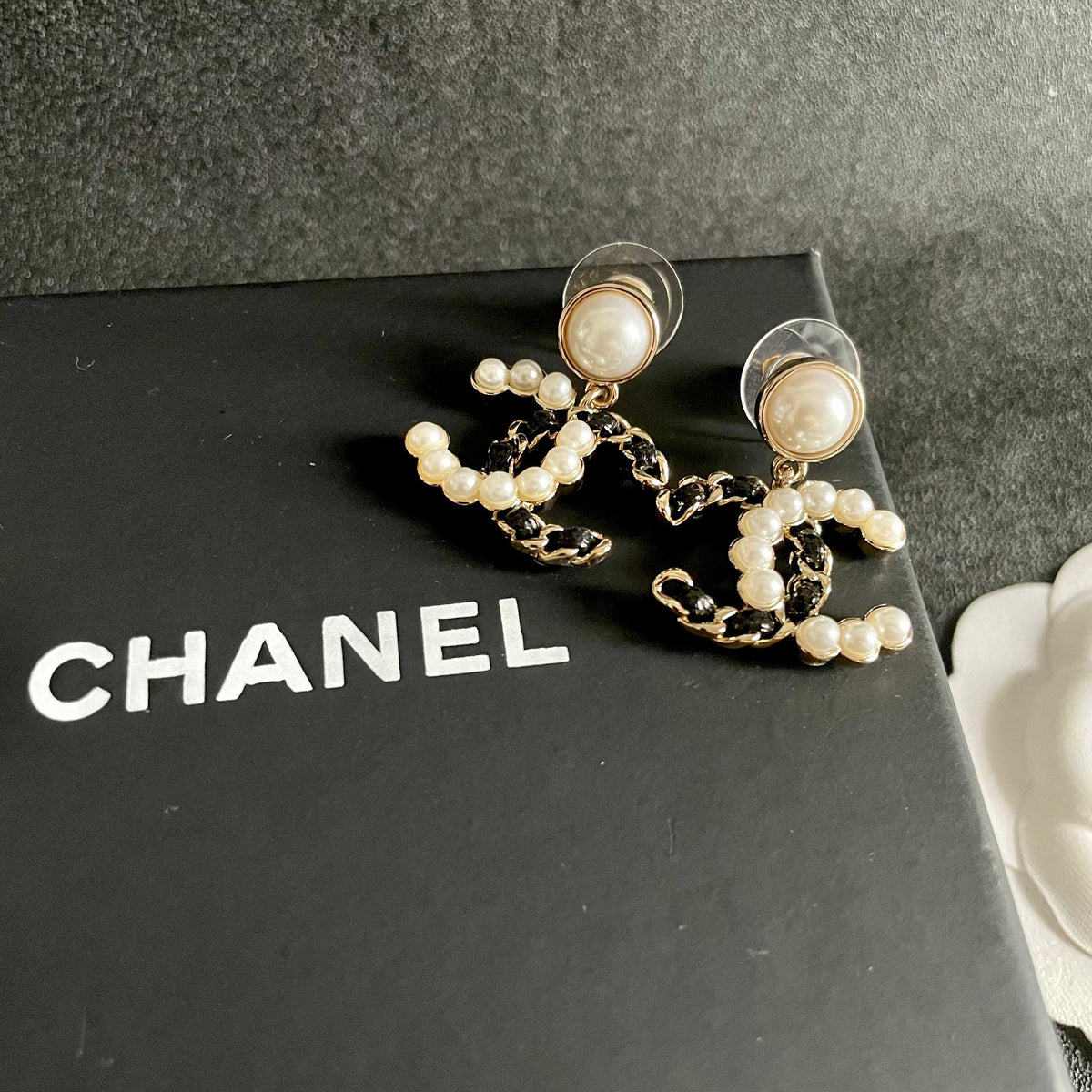 Martin Graham stud earrings in polished metal-tone – detail view