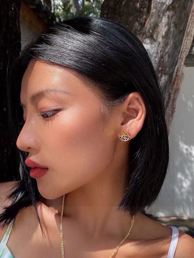 Martin Graham stud earrings in polished metal-tone – detail view