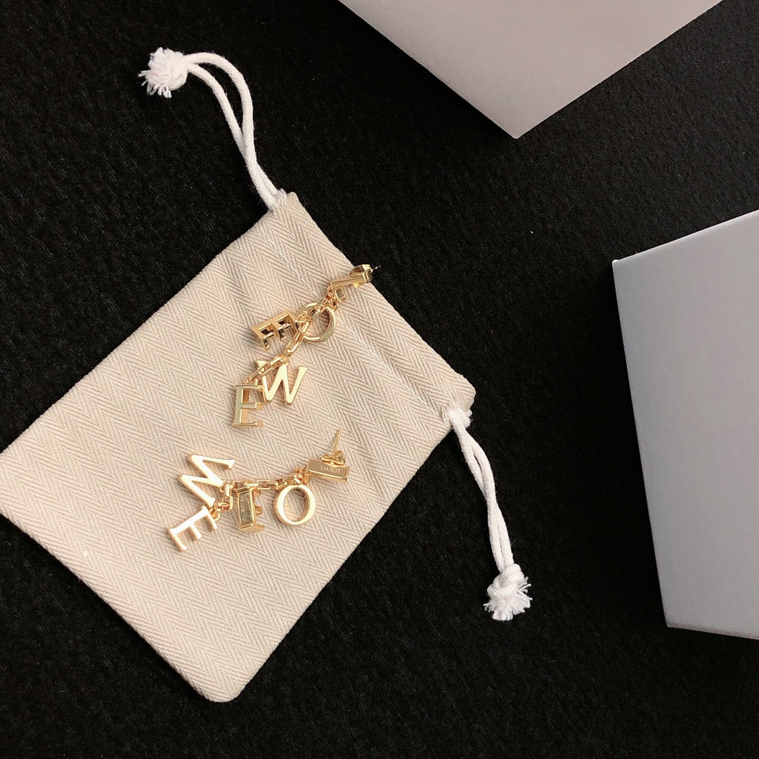 Martin Graham stud earrings in polished metal-tone – detail view