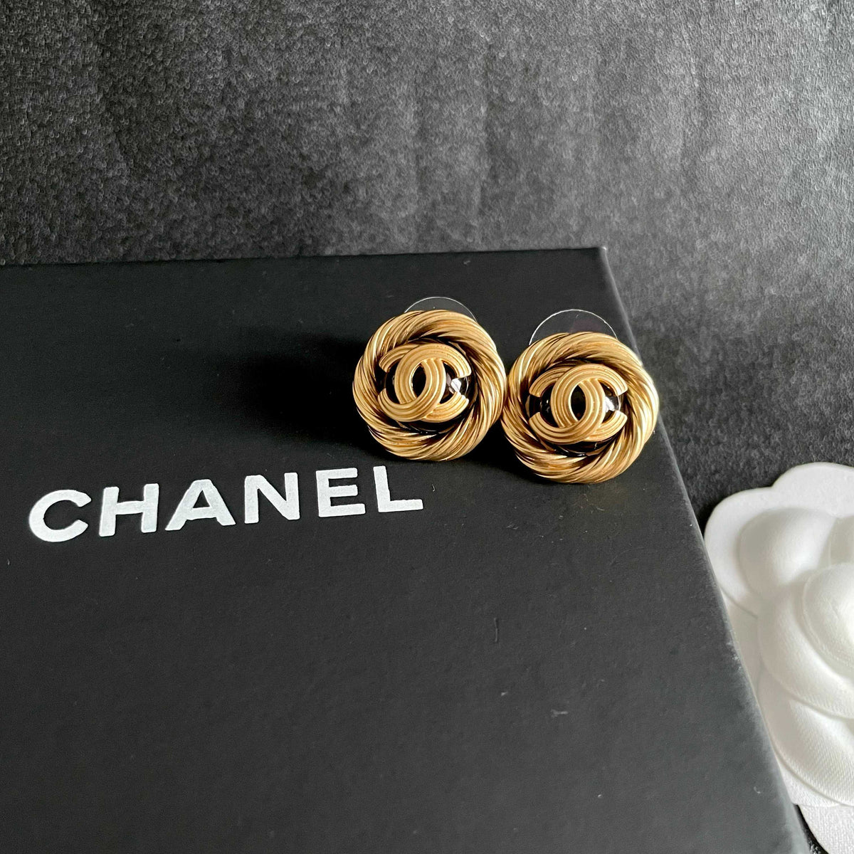 Martin Graham stud earrings in polished metal-tone – detail view