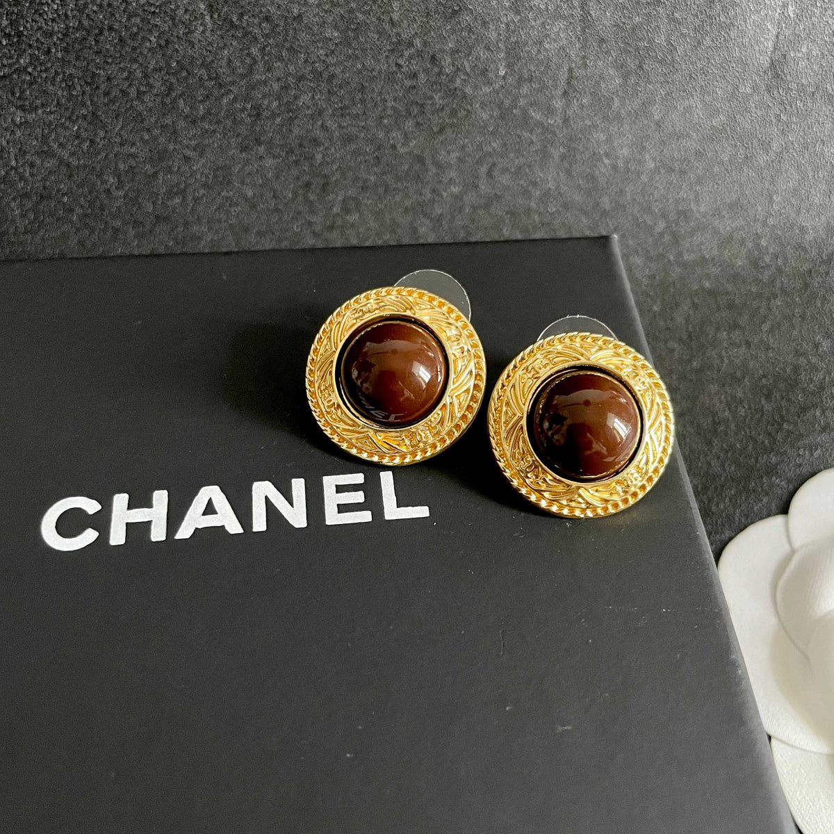 Martin Graham stud earrings in polished metal-tone – detail view