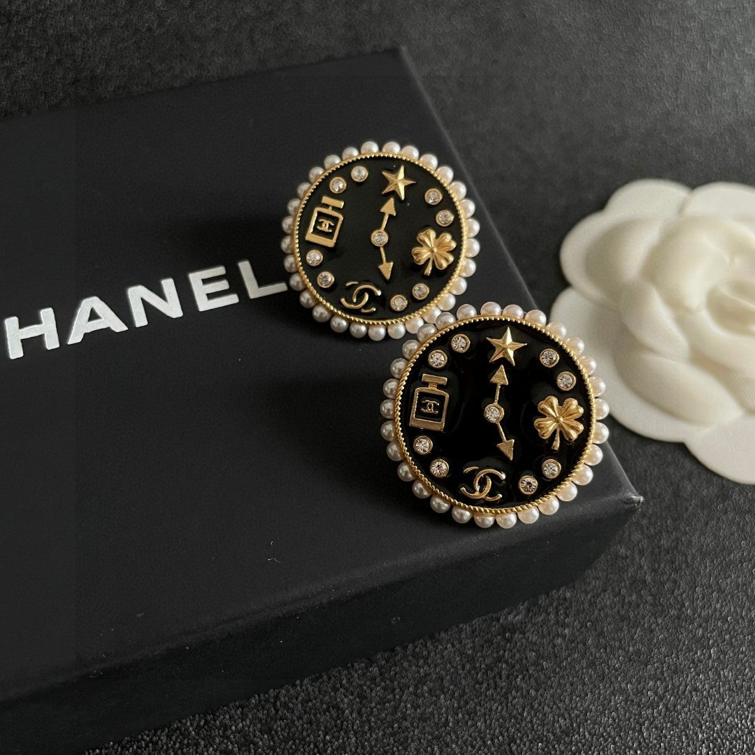Martin Graham stud earrings in polished metal-tone – detail view