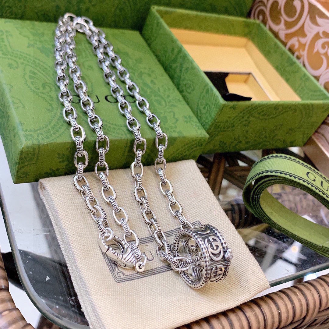 Martin Graham pendant necklace in polished metal-tone – detail view