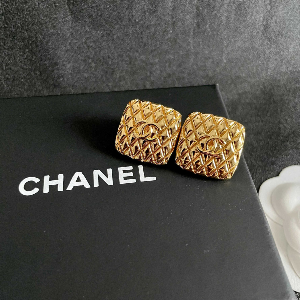 Martin Graham stud earrings in polished metal-tone – detail view