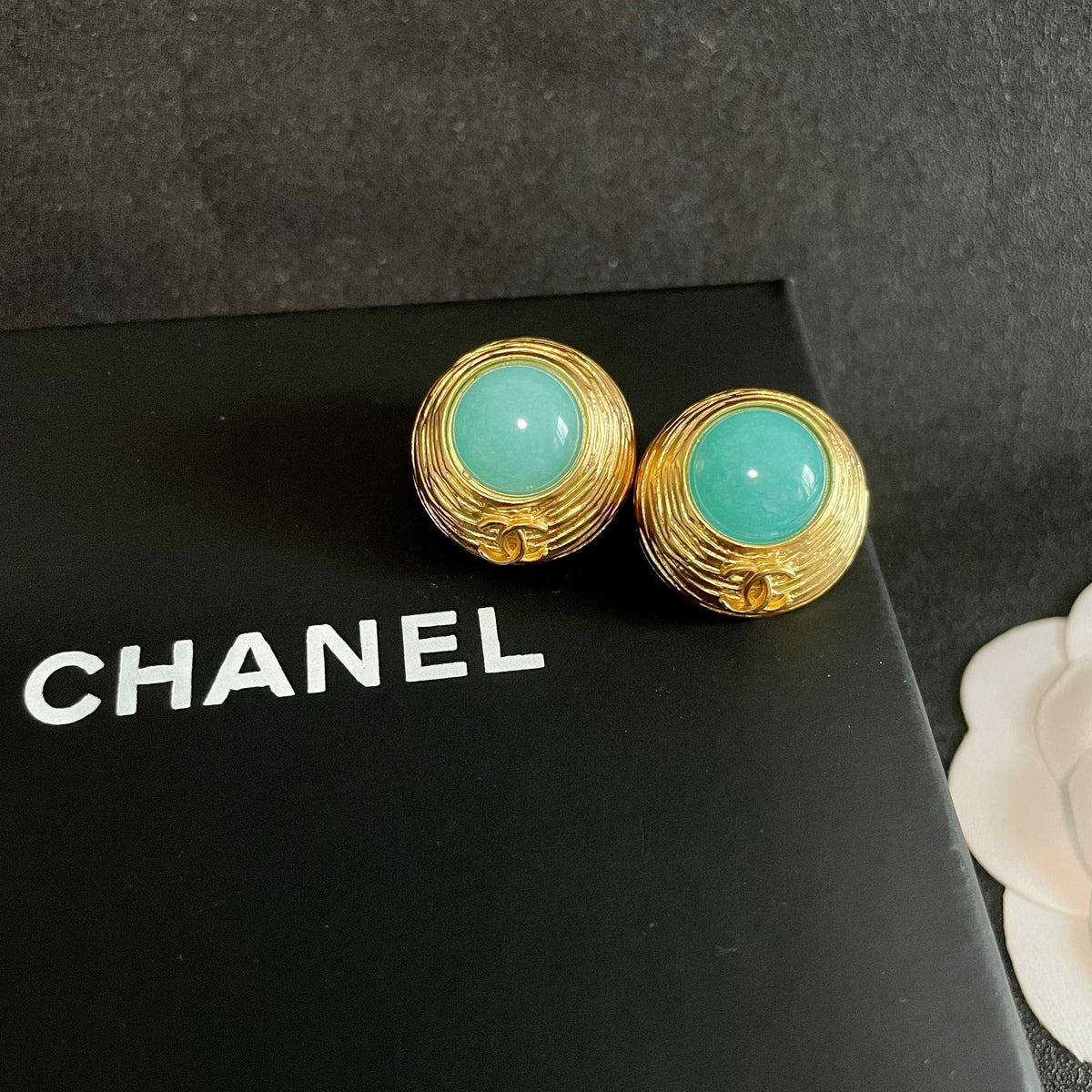 Martin Graham stud earrings in polished metal-tone – detail view
