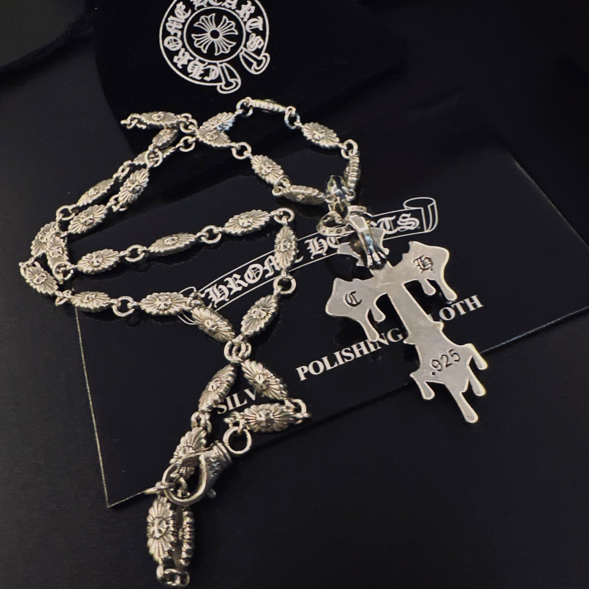 Martin Graham pendant necklace in polished metal-tone – detail view