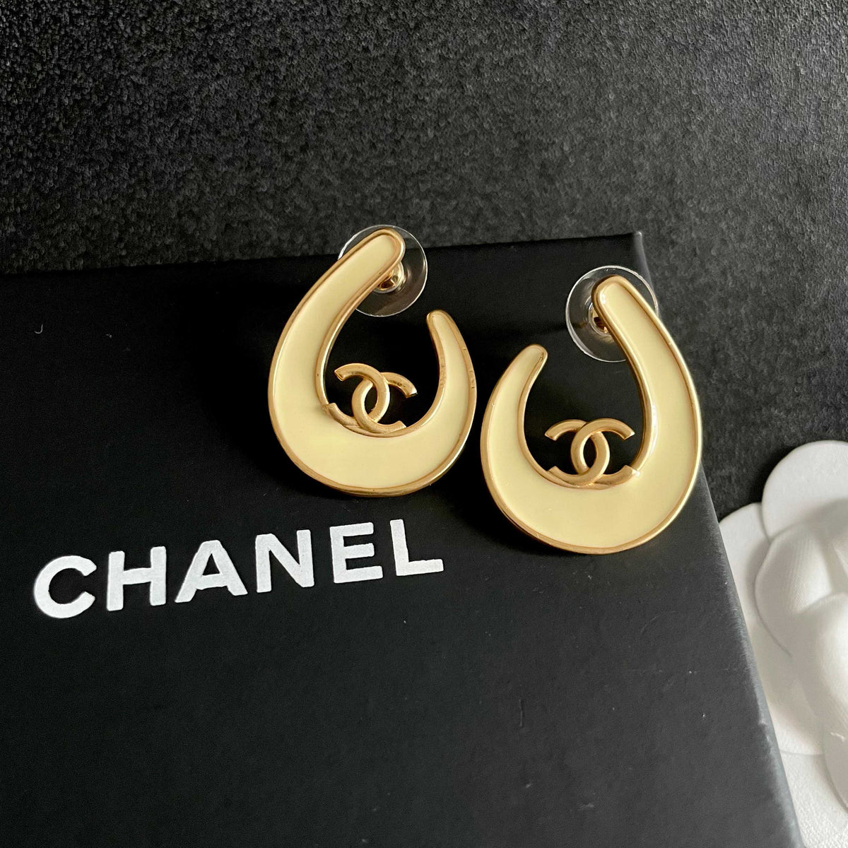 Martin Graham stud earrings in polished metal-tone – detail view