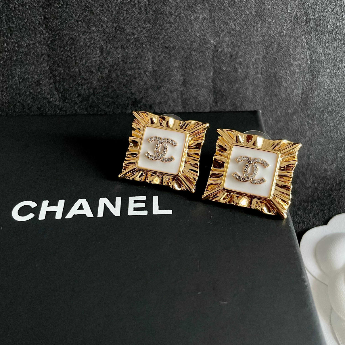 Martin Graham stud earrings in polished metal-tone – detail view