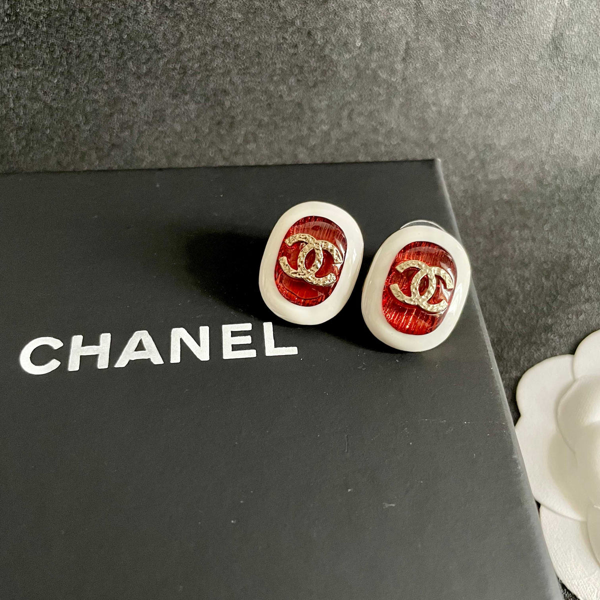 Martin Graham stud earrings in polished metal-tone – detail view