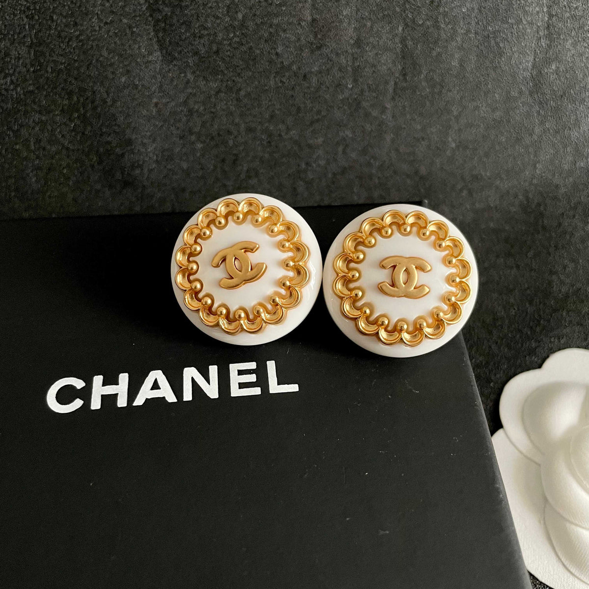 Martin Graham stud earrings in polished metal-tone – detail view