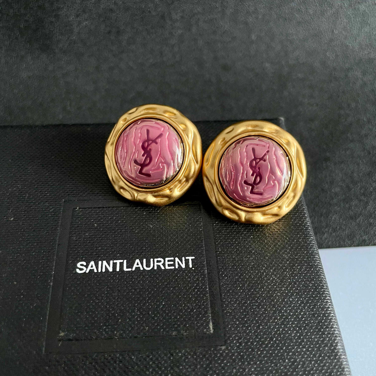 Martin Graham stud earrings in polished metal-tone – detail view