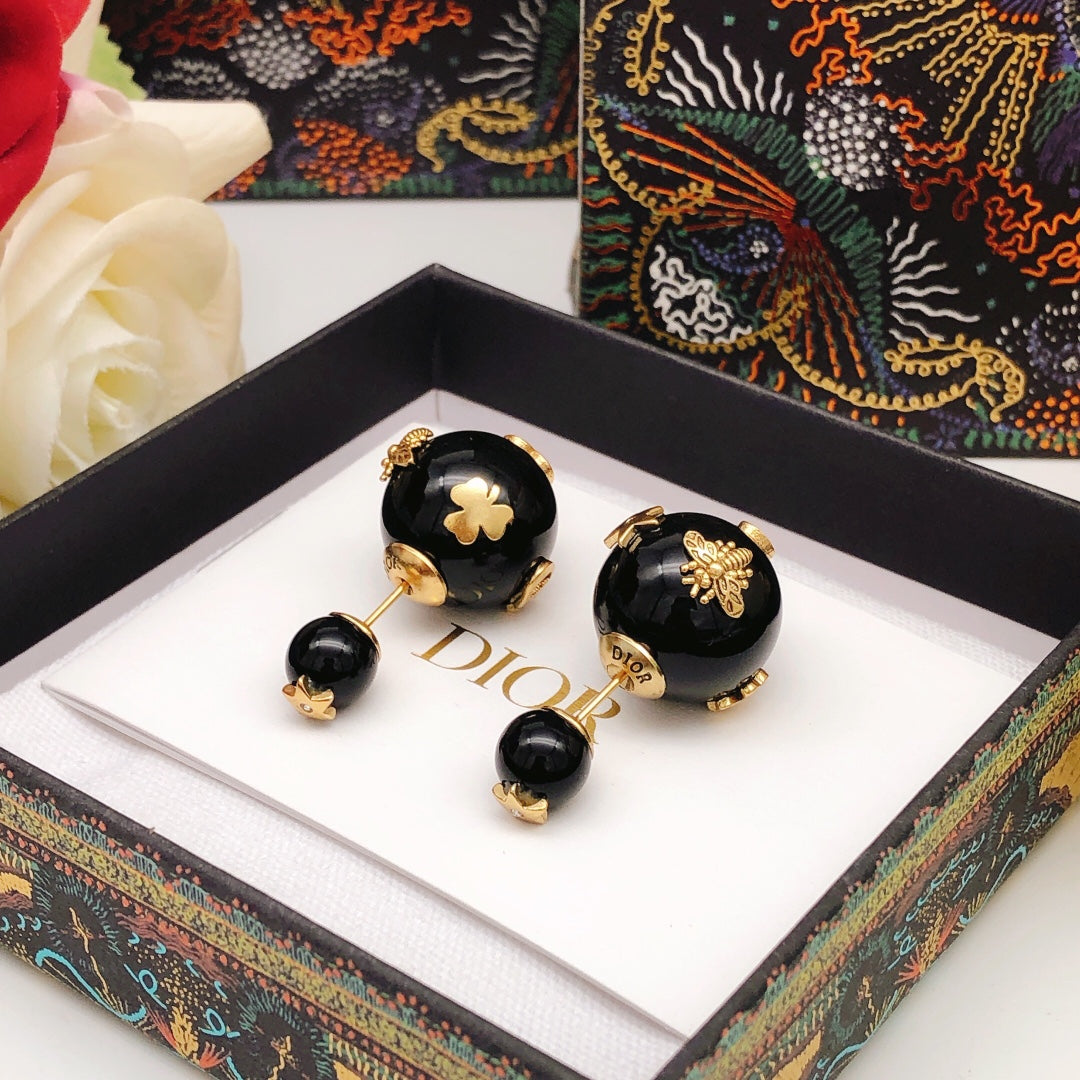 Martin Graham stud earrings in polished metal-tone – detail view