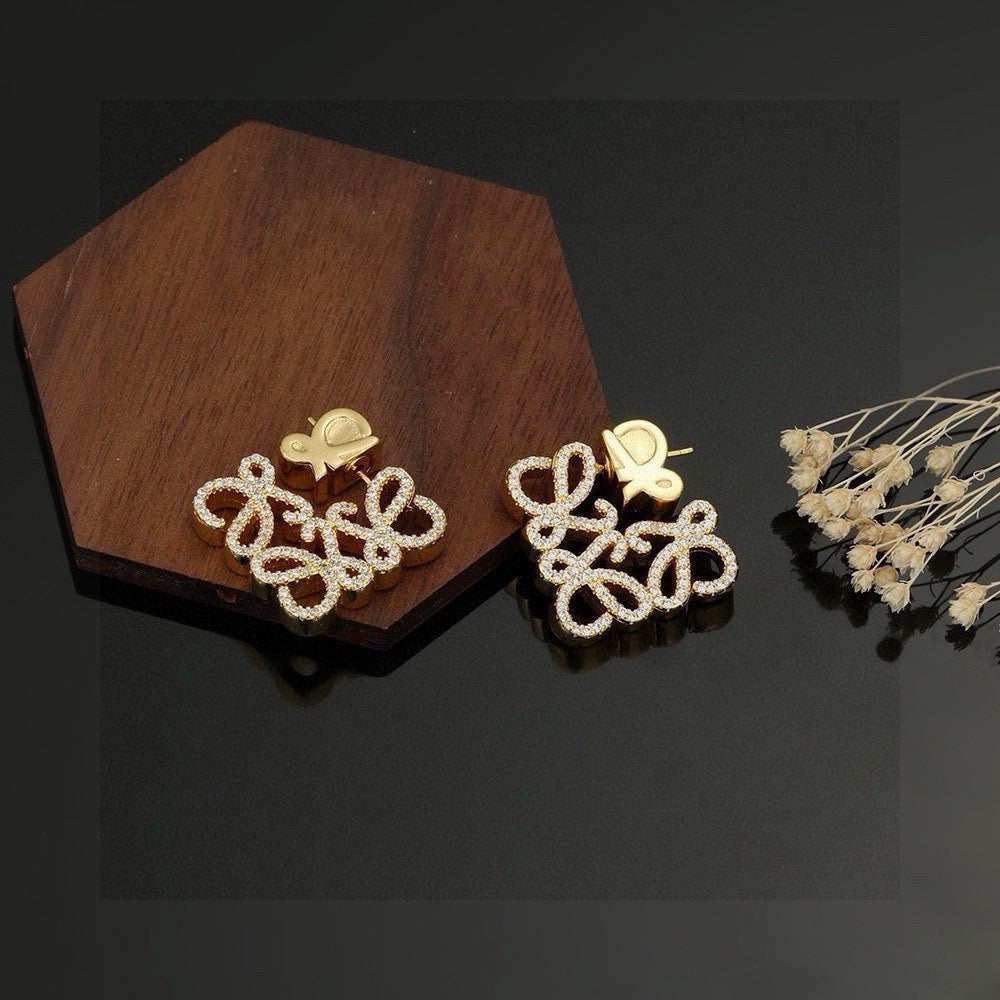 Martin Graham stud earrings in polished metal-tone – detail view