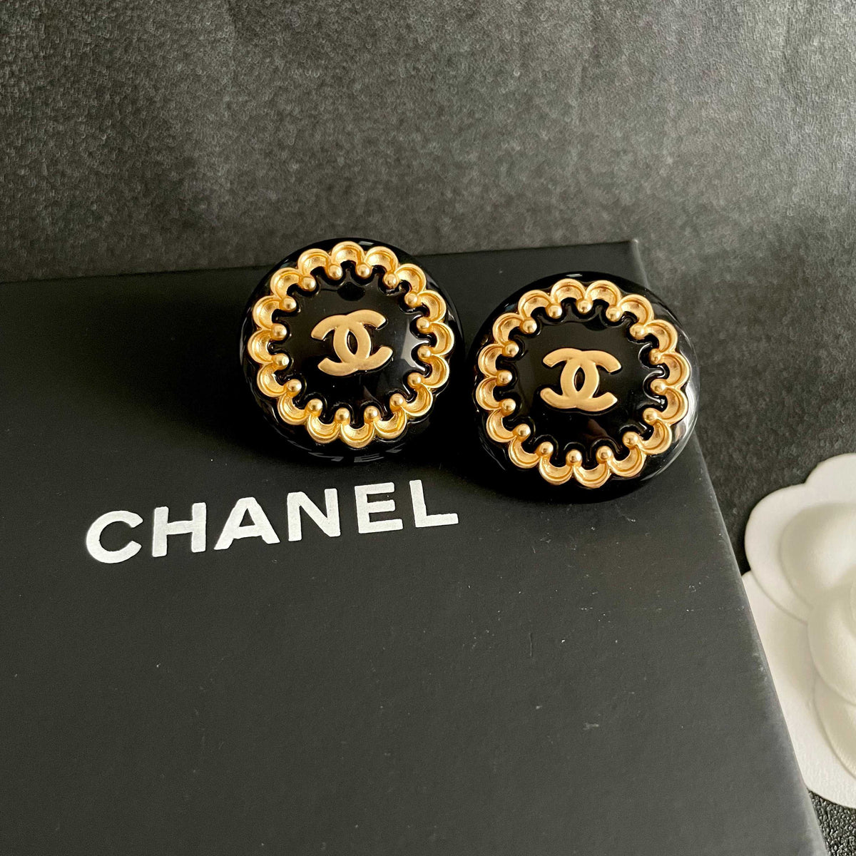 Martin Graham stud earrings in polished metal-tone – detail view