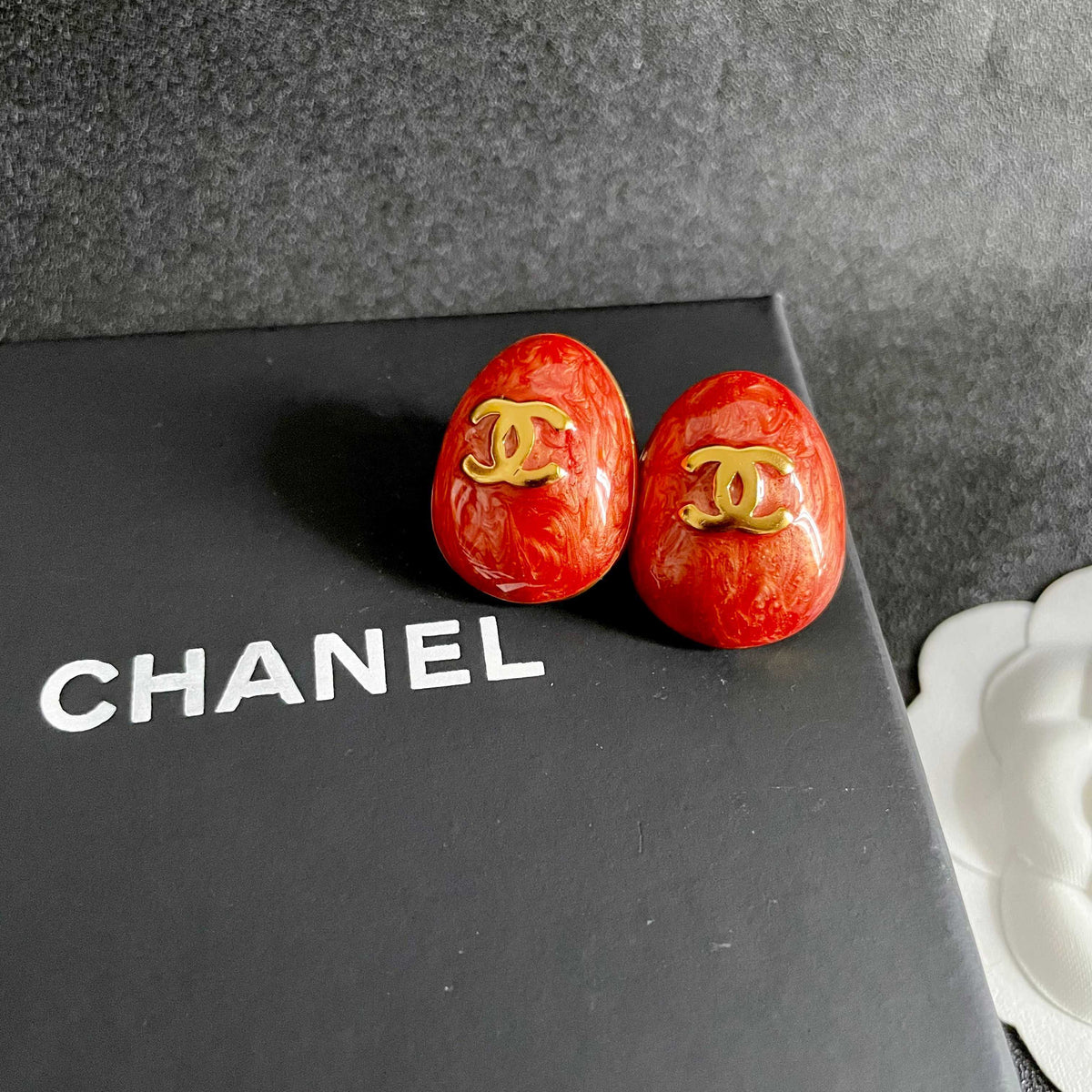 Martin Graham stud earrings in polished metal-tone – detail view