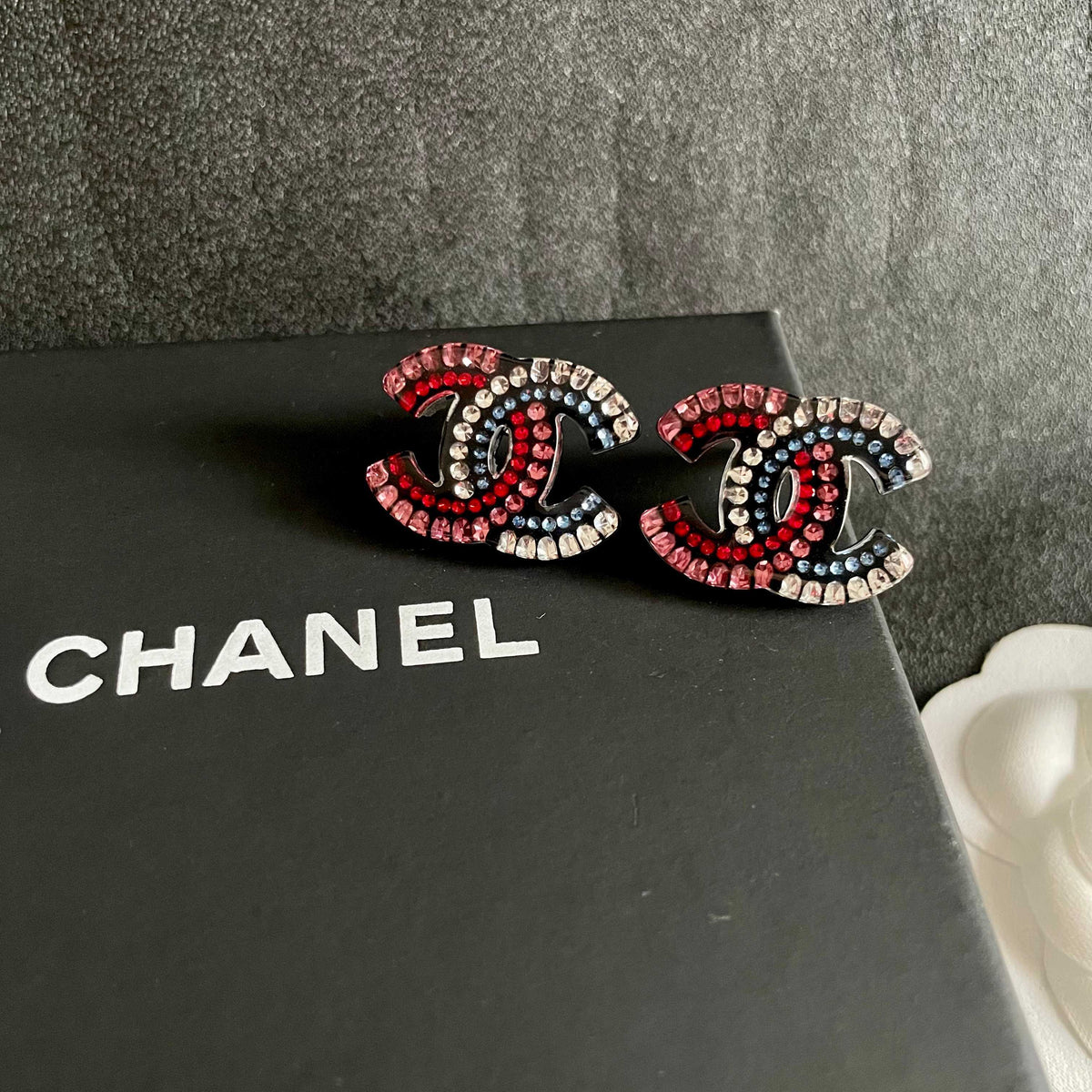 Martin Graham stud earrings in polished metal-tone – detail view